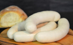 Swiss Style Bratwurst on a cutting board