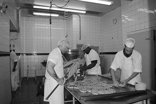 Butchers at work in the original production room