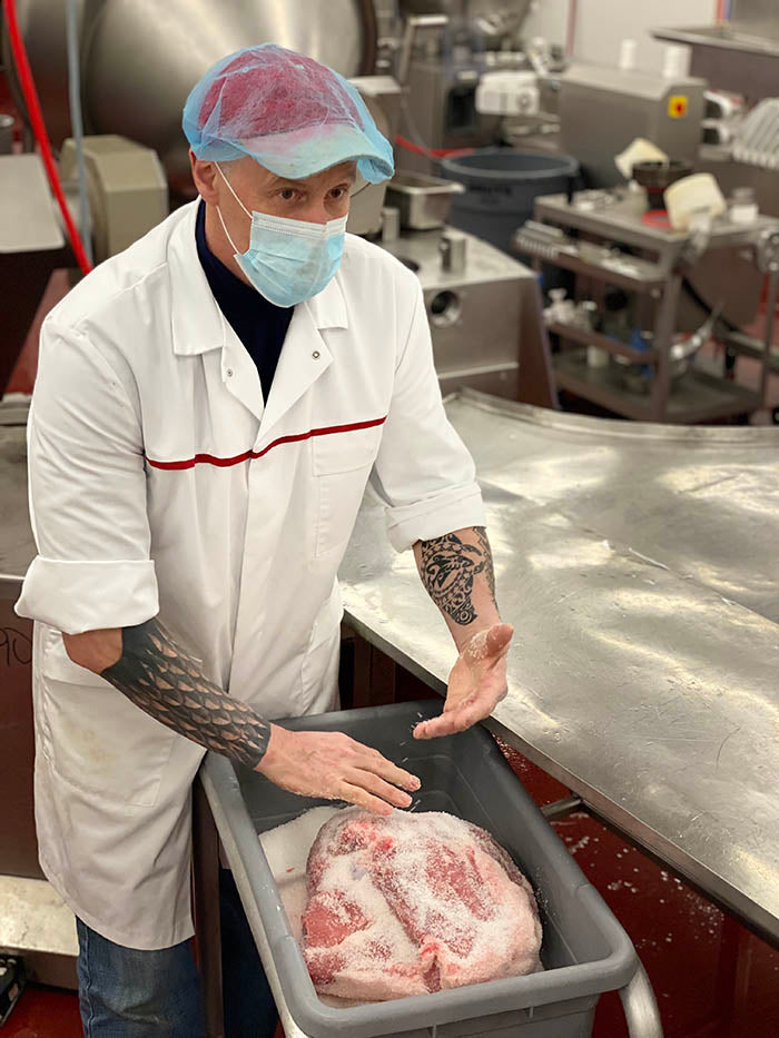 Josef explaining ham salting