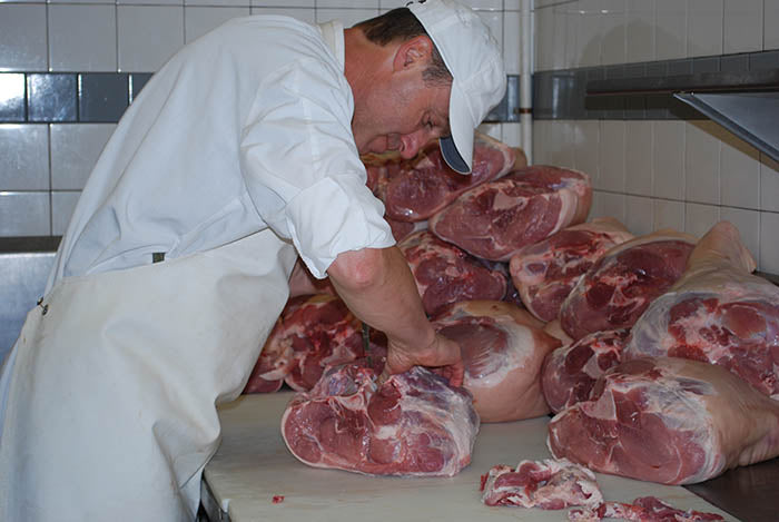 Josef with hams in production