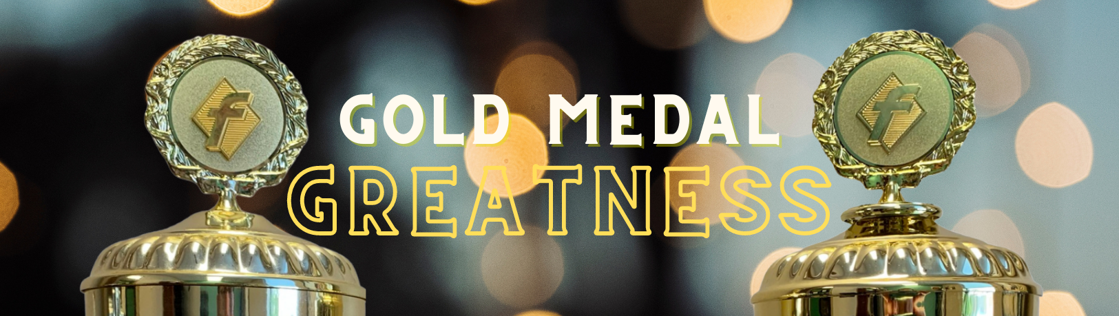 Gold awards against warm lights