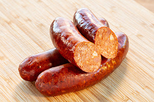 Smoked chorizo sausages on a wooden board