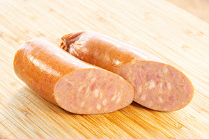 Smoked Kielbasa sausages on a wooden board