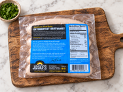 Oktoberfest Bratwurst back package on a wooden board with parsley